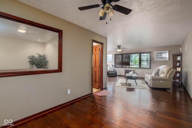 16226 Montrose Ln, Westfield, IN 46074 - living room with ceiling fan, a textured ceiling, baseboards, and wood finished floors