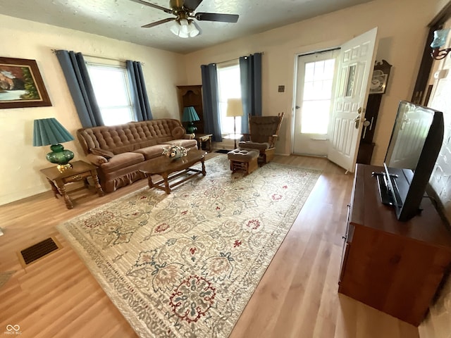 357 S Main St, Spencer, IN 47460 - living area featuring ceiling fan, healthy amount of natural light, wood finished floors, and baseboards