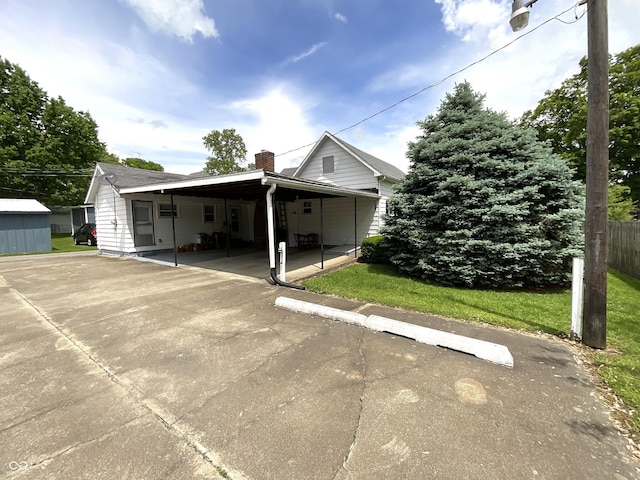 357 S Main St, Spencer, IN 47460 - view of front of home featuring a chimney and a carport