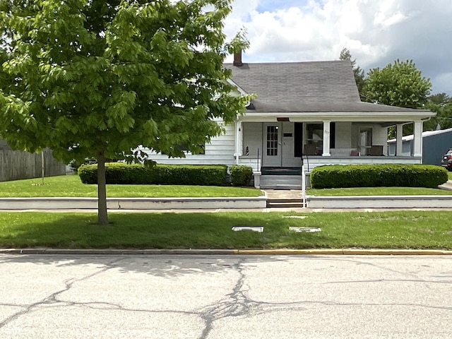 357 S Main St, Spencer, IN 47460 - view of front of home with covered porch and roof with shingles