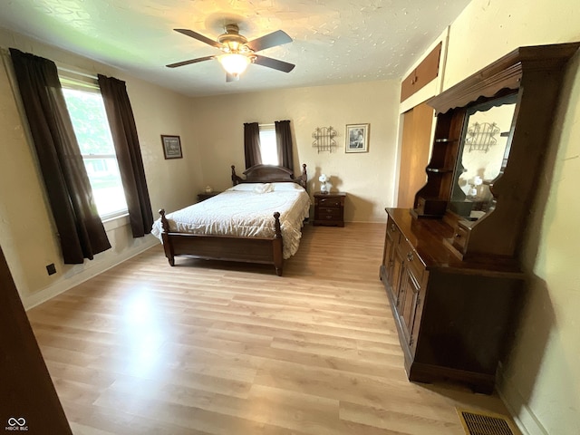 357 S Main St, Spencer, IN 47460 - bedroom with light wood-style floors, a ceiling fan, and baseboards