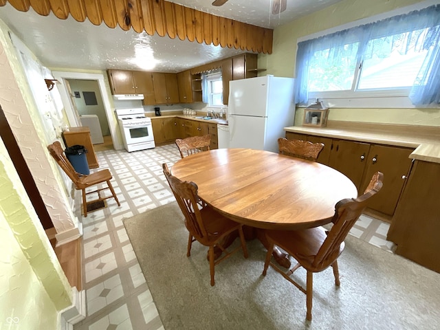 357 S Main St, Spencer, IN 47460 - dining space with light floors and a ceiling fan