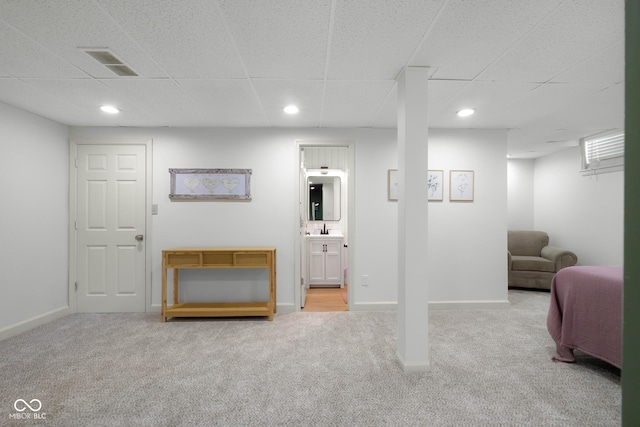 3781 S Station Dr, Columbus, IN 47203 - finished below grade area featuring carpet, a drop ceiling, a sink, baseboards, and recessed lighting