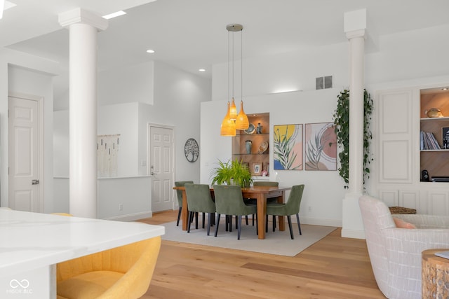 3781 S Station Dr, Columbus, IN 47203 - dining area with decorative columns, light wood-style flooring, recessed lighting, and baseboards