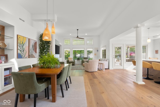 3781 S Station Dr, Columbus, IN 47203 - dining space with light wood-style floors, a ceiling fan, recessed lighting, and ornate columns