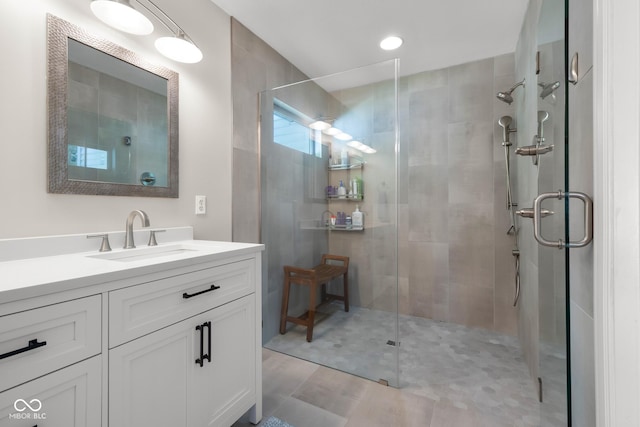 3781 S Station Dr, Columbus, IN 47203 - bathroom featuring a shower stall, vanity, and wood finished floors
