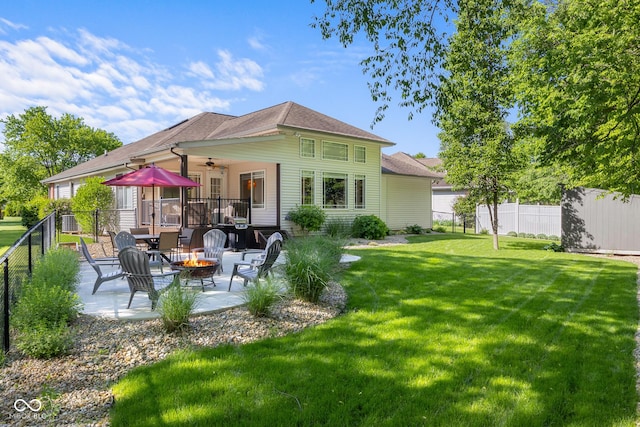 3781 S Station Dr, Columbus, IN 47203 - rear view of property with an outdoor fire pit, ceiling fan, a patio area, roof with shingles, and a wooden deck