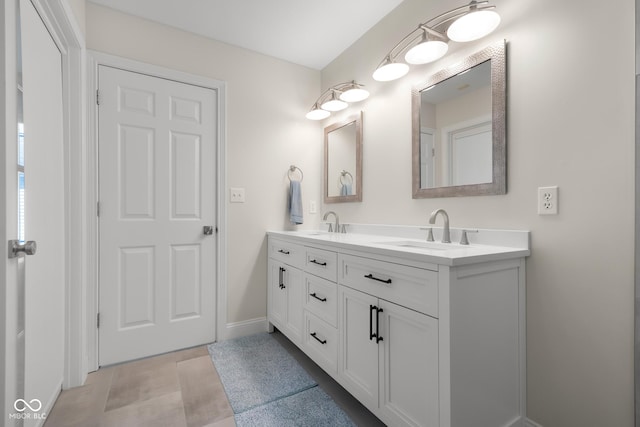 3781 S Station Dr, Columbus, IN 47203 - full bathroom featuring double vanity and baseboards