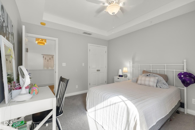 3781 S Station Dr, Columbus, IN 47203 - bedroom with carpet flooring, baseboards, a ceiling fan, and a tray ceiling