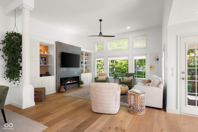 3781 S Station Dr, Columbus, IN 47203 - living room with ceiling fan, light wood-style floors, a tiled fireplace, recessed lighting, and baseboards