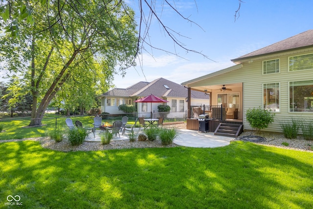 3781 S Station Dr, Columbus, IN 47203 - view of yard featuring a patio, a ceiling fan, and a fire pit