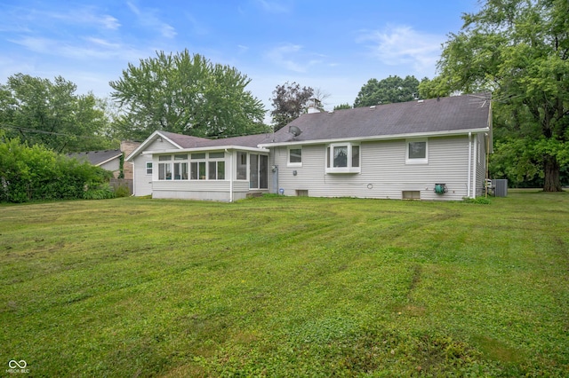 5330 W 56th St, Indianapolis, IN 46254 - rear view of property featuring a sunroom, a yard, and a chimney