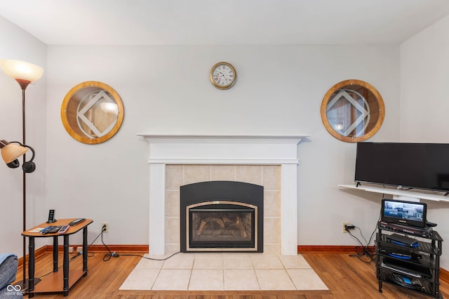 5330 W 56th St, Indianapolis, IN 46254 - living room featuring light wood-style floors and a tile fireplace