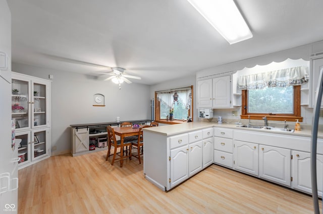 5330 W 56th St, Indianapolis, IN 46254 - kitchen featuring a peninsula, healthy amount of natural light, and white cabinetry