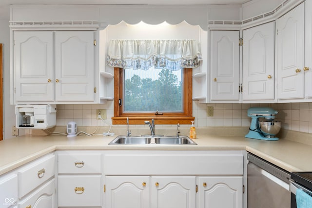 5330 W 56th St, Indianapolis, IN 46254 - kitchen featuring stainless steel dishwasher, white cabinets, backsplash, and light countertops