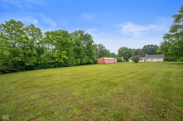 5330 W 56th St, Indianapolis, IN 46254 - view of grassy yard featuring an outdoor structure and a pole building