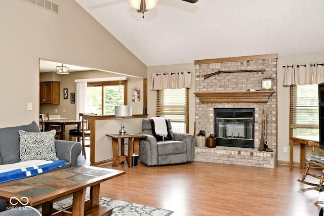 551 Windward Ln, Plainfield, IN 46168 - living area featuring wood finished floors, ceiling fan, a fireplace, and high vaulted ceiling
