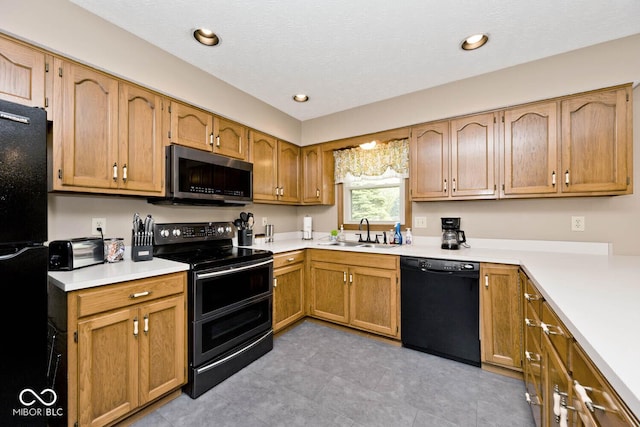 551 Windward Ln, Plainfield, IN 46168 - kitchen featuring black appliances, a sink, light countertops, recessed lighting, and brown cabinets