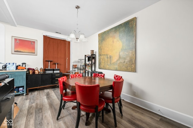 1446 N Illinois St, Indianapolis, IN 46202 - dining space with a chandelier, wood finished floors, and baseboards