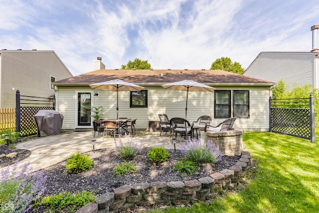 14291 Holly Berry Cir, Fishers, IN 46038 - rear view of house featuring a patio and a chimney