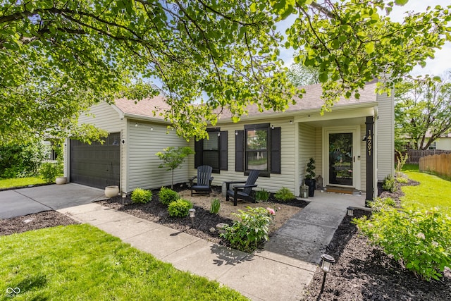 14291 Holly Berry Cir, Fishers, IN 46038 - view of front of home with an attached garage, driveway, and roof with shingles