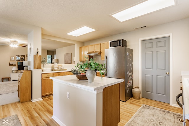 14291 Holly Berry Cir, Fishers, IN 46038 - kitchen featuring stainless steel appliances, light wood-type flooring, light countertops, and a textured ceiling