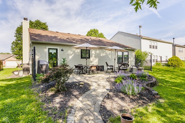 14291 Holly Berry Cir, Fishers, IN 46038 - rear view of house featuring a chimney, a patio, and roof with shingles