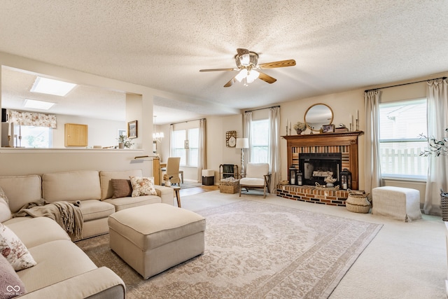 14291 Holly Berry Cir, Fishers, IN 46038 - living room with healthy amount of natural light, a textured ceiling, carpet floors, ceiling fan, and a fireplace