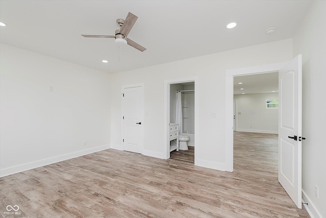 2302 S Pennsylvania St, Indianapolis, IN 46225 - unfurnished bedroom featuring light wood finished floors, ensuite bathroom, recessed lighting, baseboards, and a ceiling fan