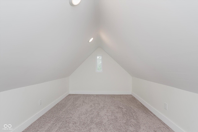 2302 S Pennsylvania St, Indianapolis, IN 46225 - bonus room featuring lofted ceiling, carpet floors, and baseboards