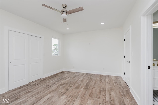 2302 S Pennsylvania St, Indianapolis, IN 46225 - unfurnished bedroom featuring light wood-type flooring, a closet, baseboards, ceiling fan, and recessed lighting