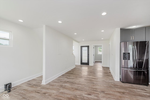 2302 S Pennsylvania St, Indianapolis, IN 46225 - kitchen featuring stainless steel refrigerator with ice dispenser, light wood-type flooring, baseboards, and recessed lighting