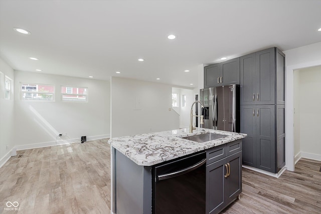 2302 S Pennsylvania St, Indianapolis, IN 46225 - kitchen featuring black dishwasher, stainless steel fridge with ice dispenser, healthy amount of natural light, light wood finished floors, and recessed lighting
