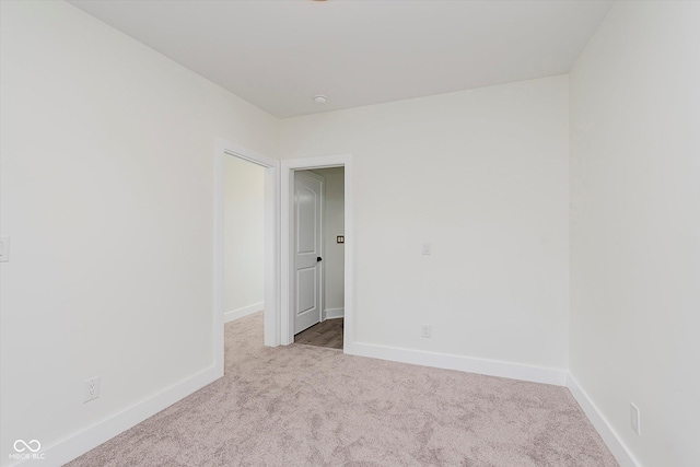 2302 S Pennsylvania St, Indianapolis, IN 46225 - empty room featuring carpet floors and baseboards