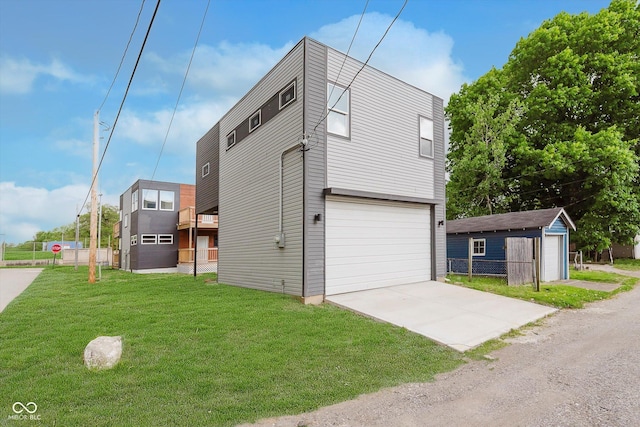 2302 S Pennsylvania St, Indianapolis, IN 46225 - view of side of home featuring a garage, driveway, and an outbuilding