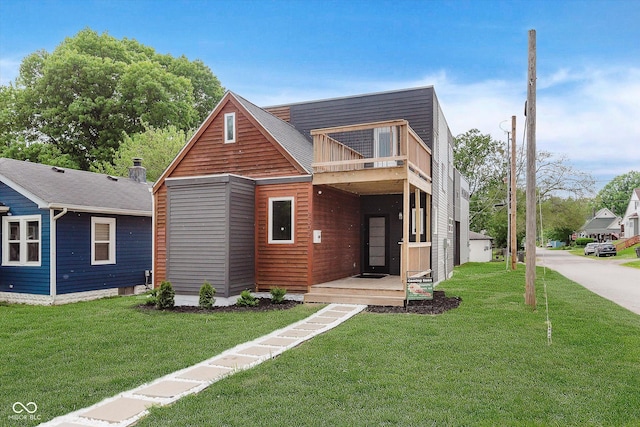 2302 S Pennsylvania St, Indianapolis, IN 46225 - contemporary house featuring a balcony and a front lawn