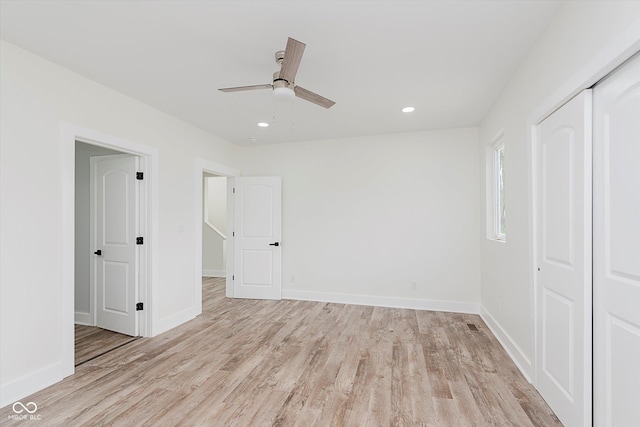 2302 S Pennsylvania St, Indianapolis, IN 46225 - unfurnished bedroom featuring light wood-style floors, a closet, baseboards, recessed lighting, and a ceiling fan