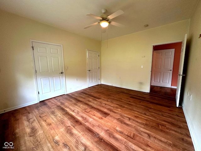 800 Eastfield Dr, Crawfordsville, IN 47933 - unfurnished bedroom with wood finished floors, baseboards, and ceiling fan