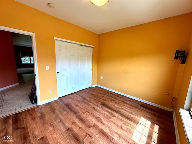 800 Eastfield Dr, Crawfordsville, IN 47933 - unfurnished bedroom with wood finished floors and baseboards