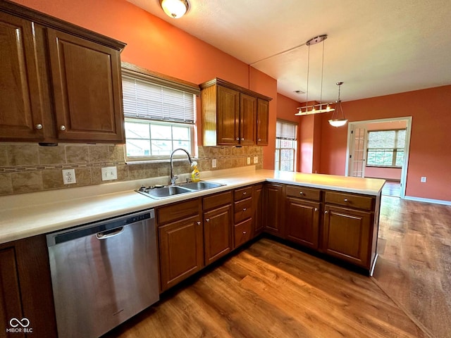 800 Eastfield Dr, Crawfordsville, IN 47933 - kitchen featuring stainless steel dishwasher, a sink, dark wood-style floors, and a peninsula