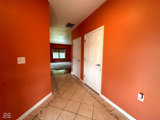 800 Eastfield Dr, Crawfordsville, IN 47933 - hall featuring inlaid floor details, baseboards, and light tile patterned floors