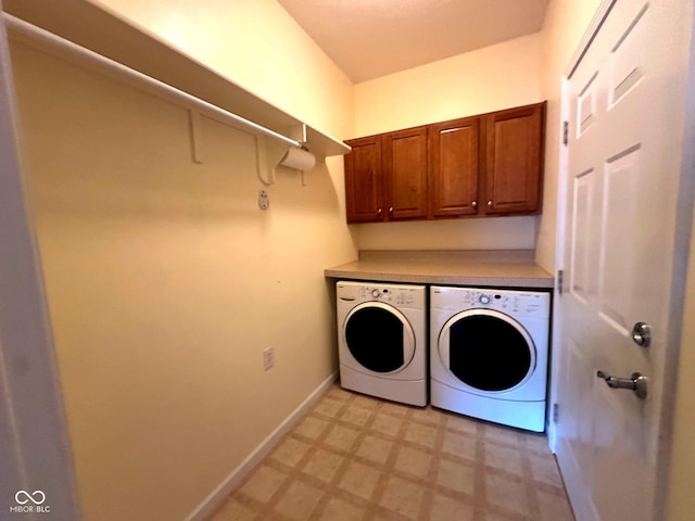 800 Eastfield Dr, Crawfordsville, IN 47933 - laundry area with light floors, washing machine and dryer, cabinet space, and baseboards