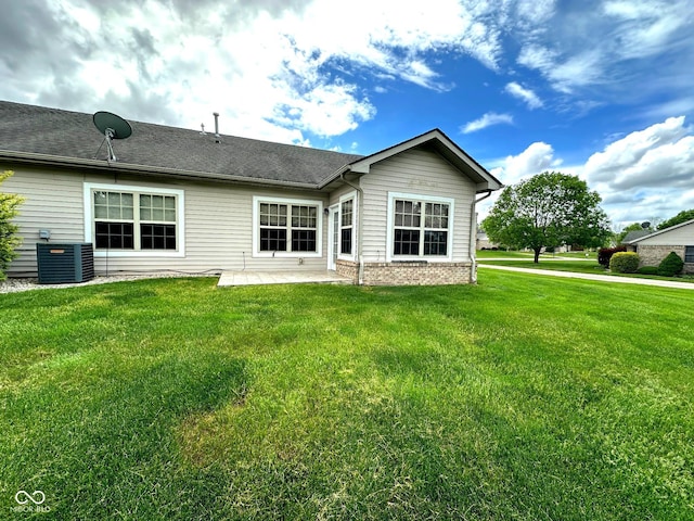 800 Eastfield Dr, Crawfordsville, IN 47933 - rear view of property with central air condition unit and a yard