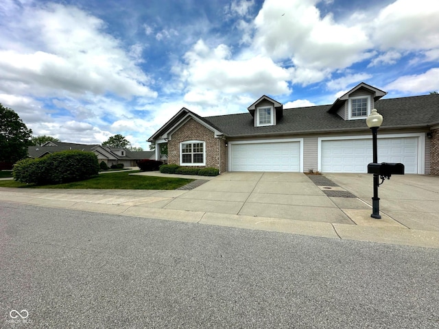 800 Eastfield Dr, Crawfordsville, IN 47933 - view of front of house featuring brick siding, driveway, and a front yard