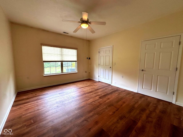 800 Eastfield Dr, Crawfordsville, IN 47933 - unfurnished bedroom featuring dark wood-type flooring, baseboards, and a ceiling fan
