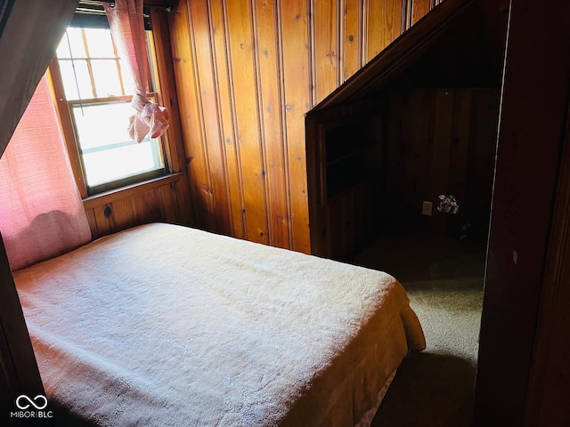 4850 E University Ave, Indianapolis, IN 46201 - bedroom featuring carpet, wooden walls, and multiple windows