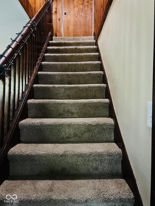 4850 E University Ave, Indianapolis, IN 46201 - stairway featuring baseboards