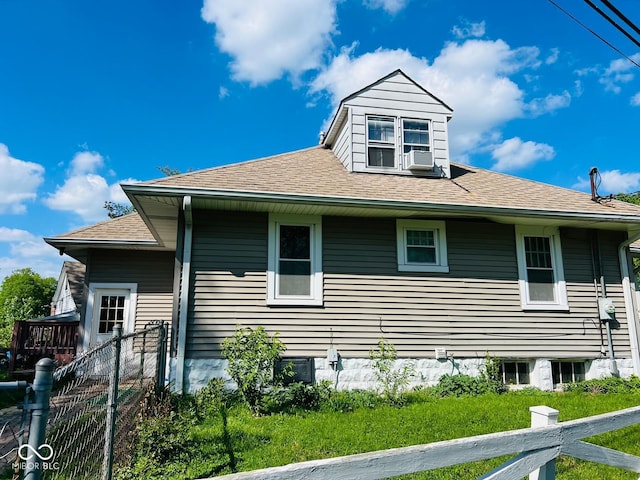 4850 E University Ave, Indianapolis, IN 46201 - view of side of property featuring fence, a shingled roof, and cooling unit