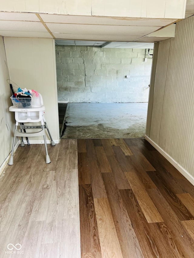 4850 E University Ave, Indianapolis, IN 46201 - finished below grade area featuring wood finished floors and concrete block wall