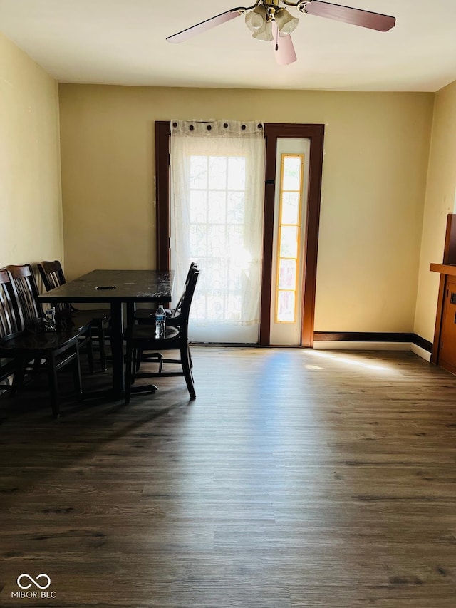 4850 E University Ave, Indianapolis, IN 46201 - dining space with ceiling fan, dark wood finished floors, and baseboards